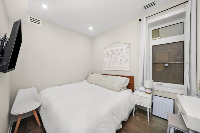 bedroom featuring dark hardwood / wood-style floors