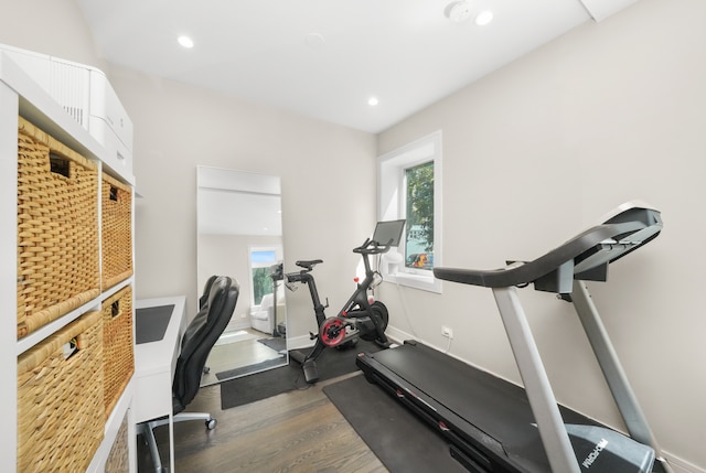 workout area with dark hardwood / wood-style floors