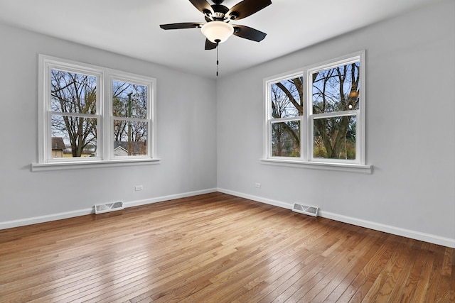 empty room with light hardwood / wood-style floors and ceiling fan