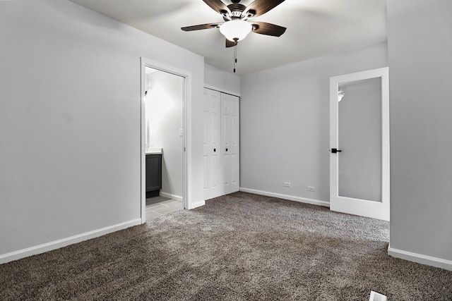 unfurnished bedroom featuring ensuite bathroom, ceiling fan, and carpet floors