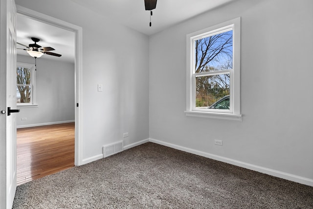 unfurnished room with hardwood / wood-style floors and ceiling fan