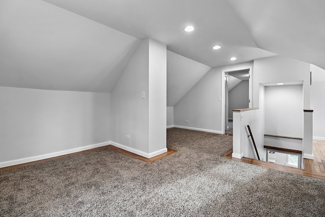 bonus room featuring carpet flooring and lofted ceiling