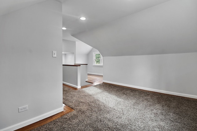 bonus room featuring carpet floors and lofted ceiling