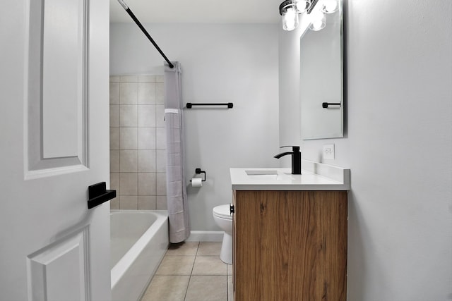 full bathroom featuring tile patterned flooring, vanity, toilet, and tiled shower / bath