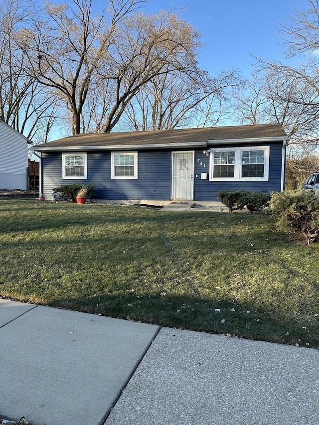 single story home featuring a front lawn