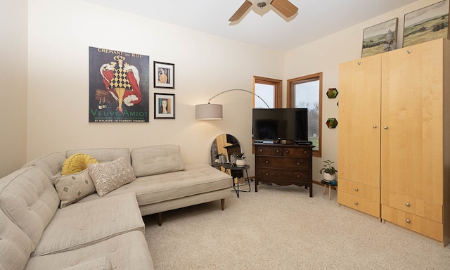 living room with carpet and ceiling fan