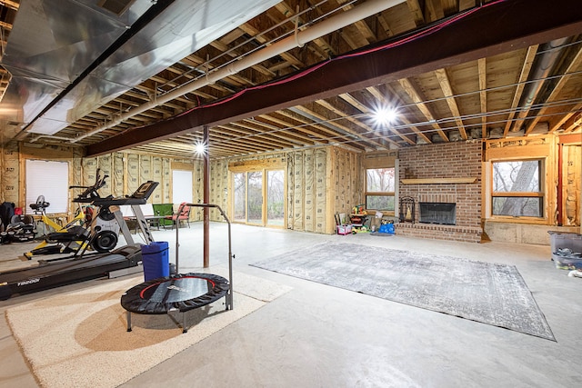 basement featuring a brick fireplace