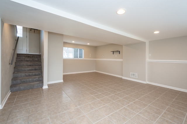 basement featuring light tile patterned floors