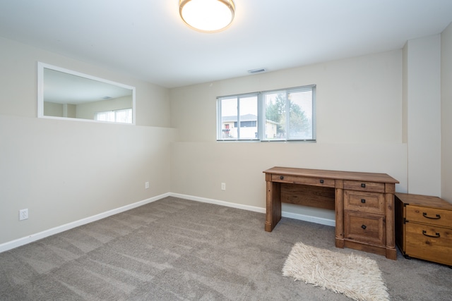 unfurnished office featuring light carpet