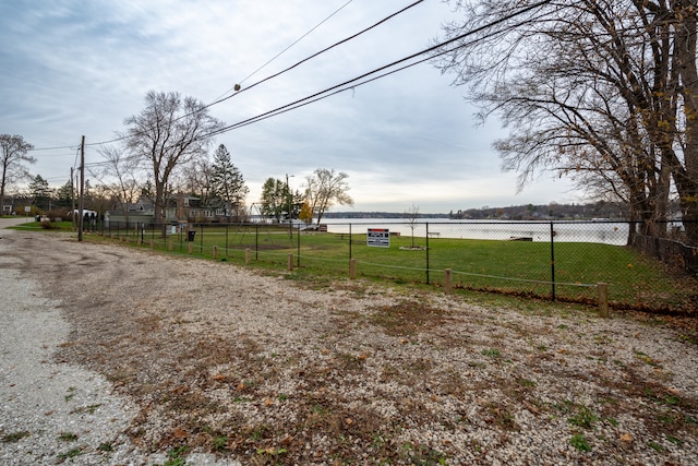 view of yard featuring a rural view and a water view