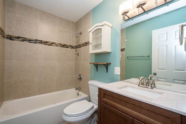 full bathroom with tiled shower / bath combo, toilet, and vanity