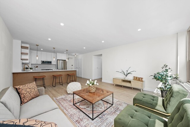 living room with light hardwood / wood-style flooring