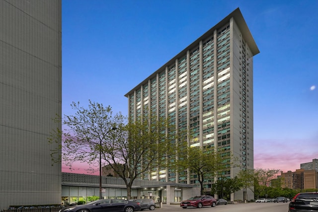 view of outdoor building at dusk