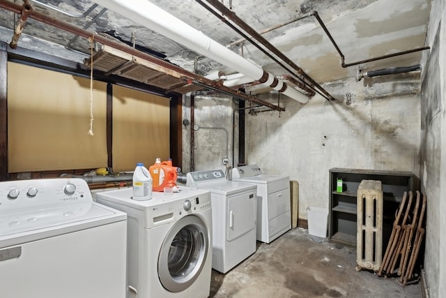 laundry room with washing machine and clothes dryer