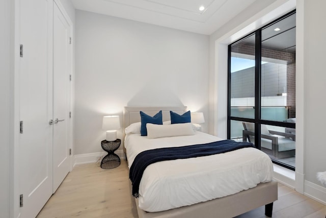 bedroom with light wood-type flooring