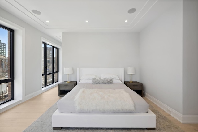 bedroom with light wood-type flooring