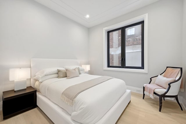 bedroom with light hardwood / wood-style flooring