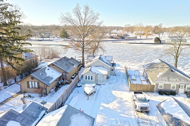 snowy aerial view featuring a residential view