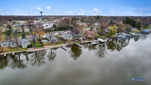 drone / aerial view with a residential view and a water view