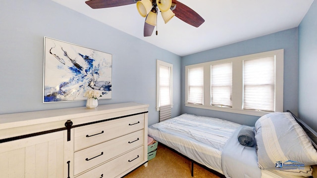 bedroom featuring light carpet and ceiling fan