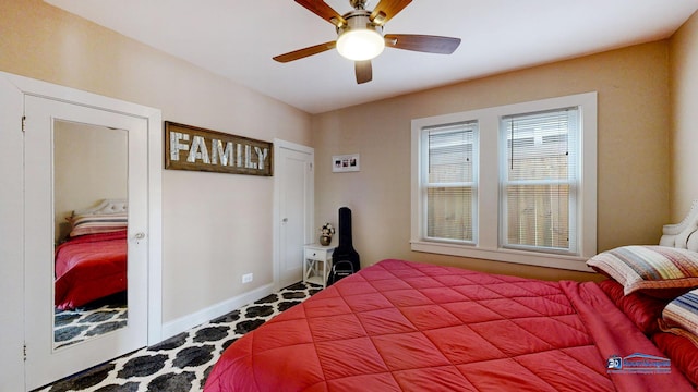 bedroom featuring baseboards and ceiling fan