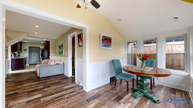 interior space with vaulted ceiling, dark wood-type flooring, and ceiling fan