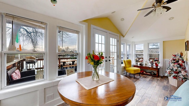 sunroom with lofted ceiling, a wealth of natural light, french doors, and ceiling fan