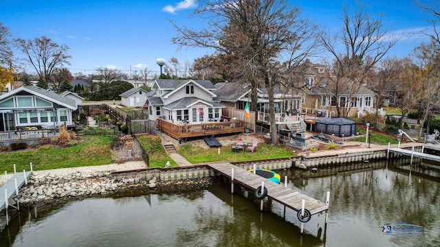 dock area with a deck with water view and a residential view