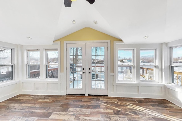 unfurnished sunroom with vaulted ceiling and french doors