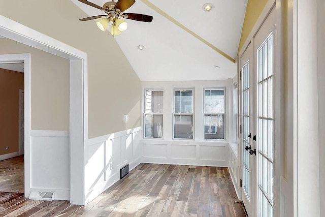 unfurnished room featuring ceiling fan, lofted ceiling, and wood-type flooring