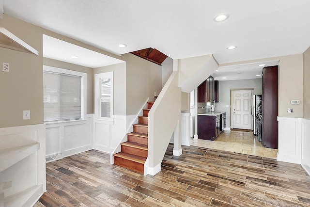 stairs with wood-type flooring