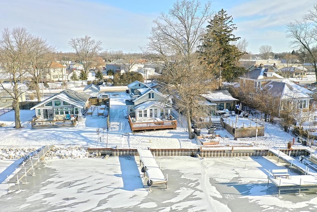 snowy aerial view with a residential view