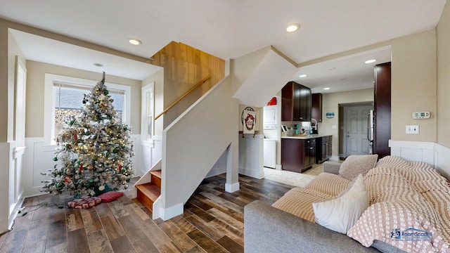 living room with recessed lighting, stairs, dark wood-style flooring, and wainscoting