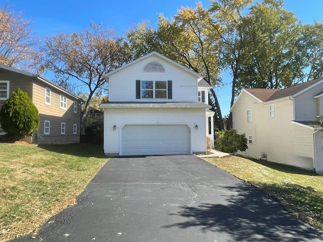 view of front facade with a garage and a front yard