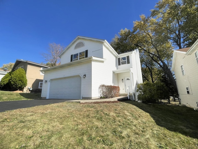 view of front of home featuring a garage and a front lawn