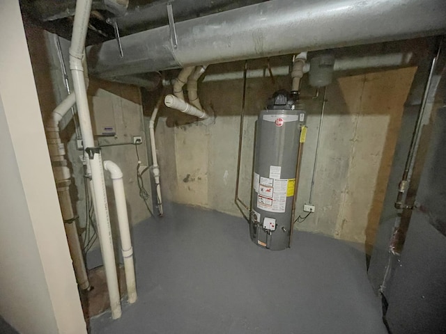 utility room featuring gas water heater