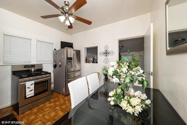 kitchen featuring ceiling fan, parquet floors, and appliances with stainless steel finishes