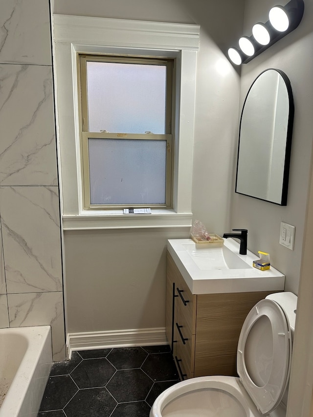 full bathroom with tile patterned floors, vanity, toilet, and shower / tub combination