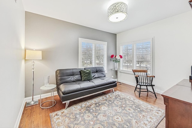 living room with wood finished floors and baseboards