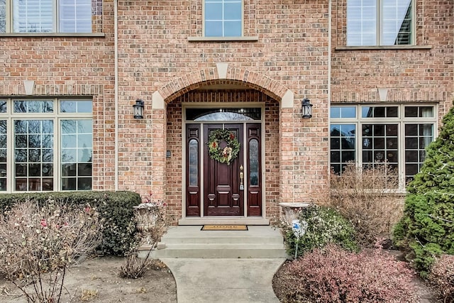 property entrance with brick siding