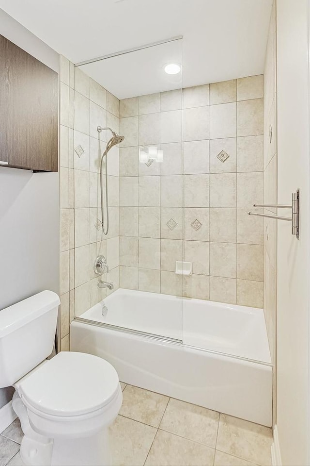 bathroom with shower / washtub combination, tile patterned flooring, and toilet