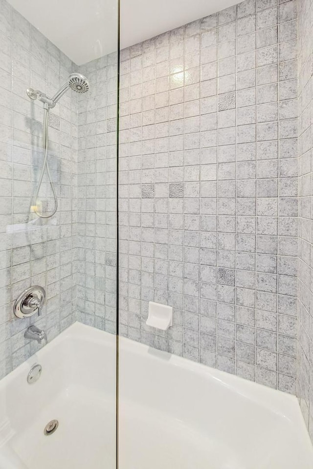 full bath featuring shower / washtub combination