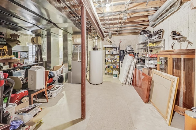 unfinished basement featuring water heater