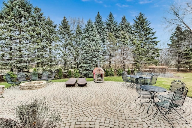 view of patio / terrace featuring an outdoor fire pit