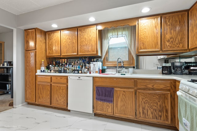 kitchen featuring sink and white appliances