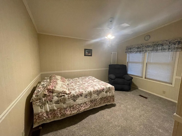 carpeted bedroom with ceiling fan, lofted ceiling, and crown molding