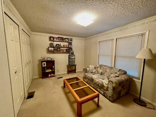 carpeted living room featuring crown molding and a textured ceiling