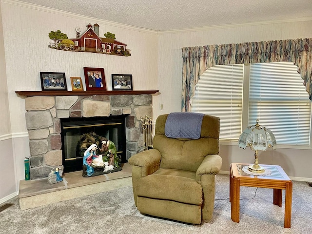 sitting room with carpet flooring, crown molding, a stone fireplace, and a textured ceiling