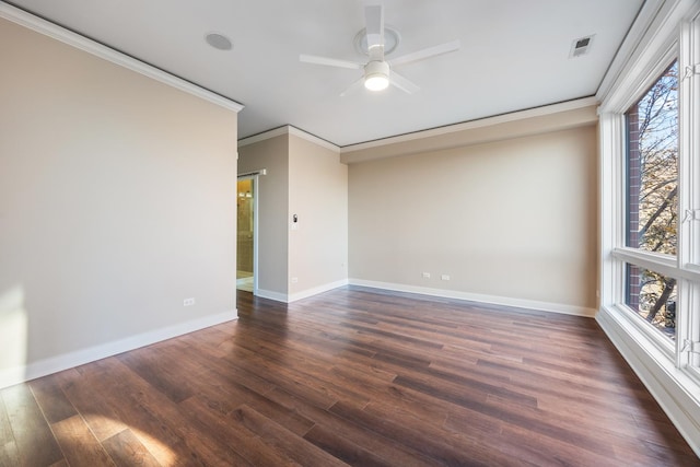 spare room with dark hardwood / wood-style floors, ceiling fan, crown molding, and a wealth of natural light