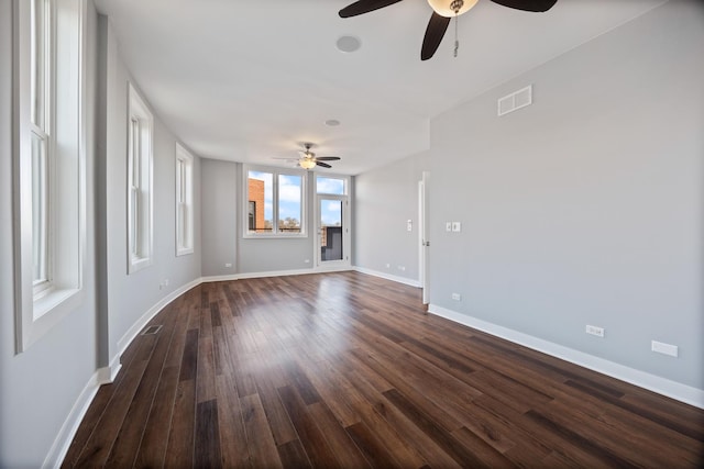 unfurnished room featuring ceiling fan and dark hardwood / wood-style floors